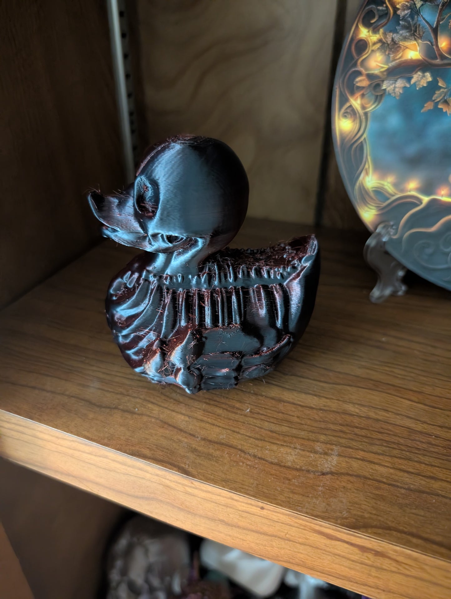 Crimson Skeleton Duck Figurine