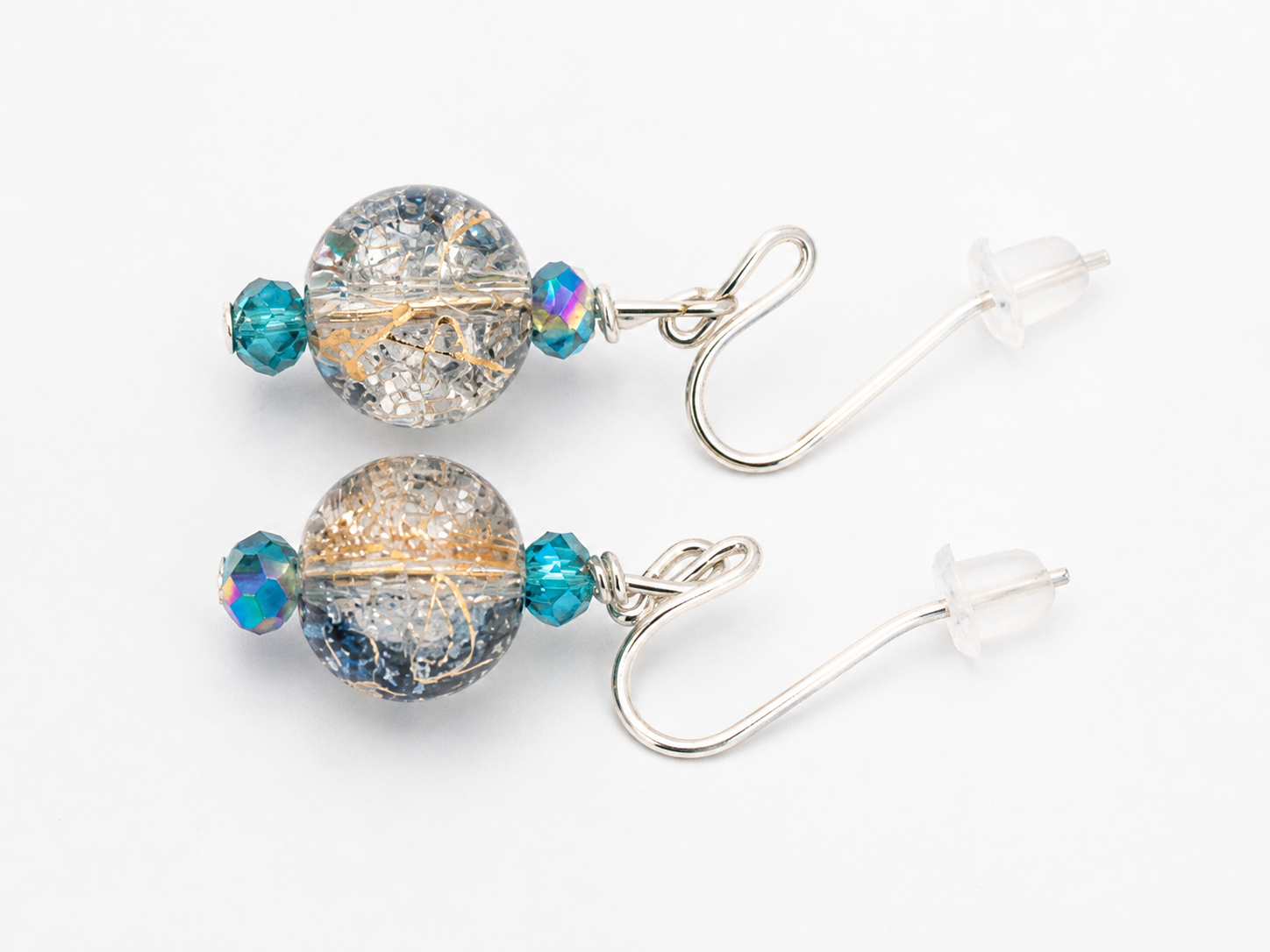 Clear crackle glass drop earrings with gold accents teal beads handmade lightweight jewelry white background