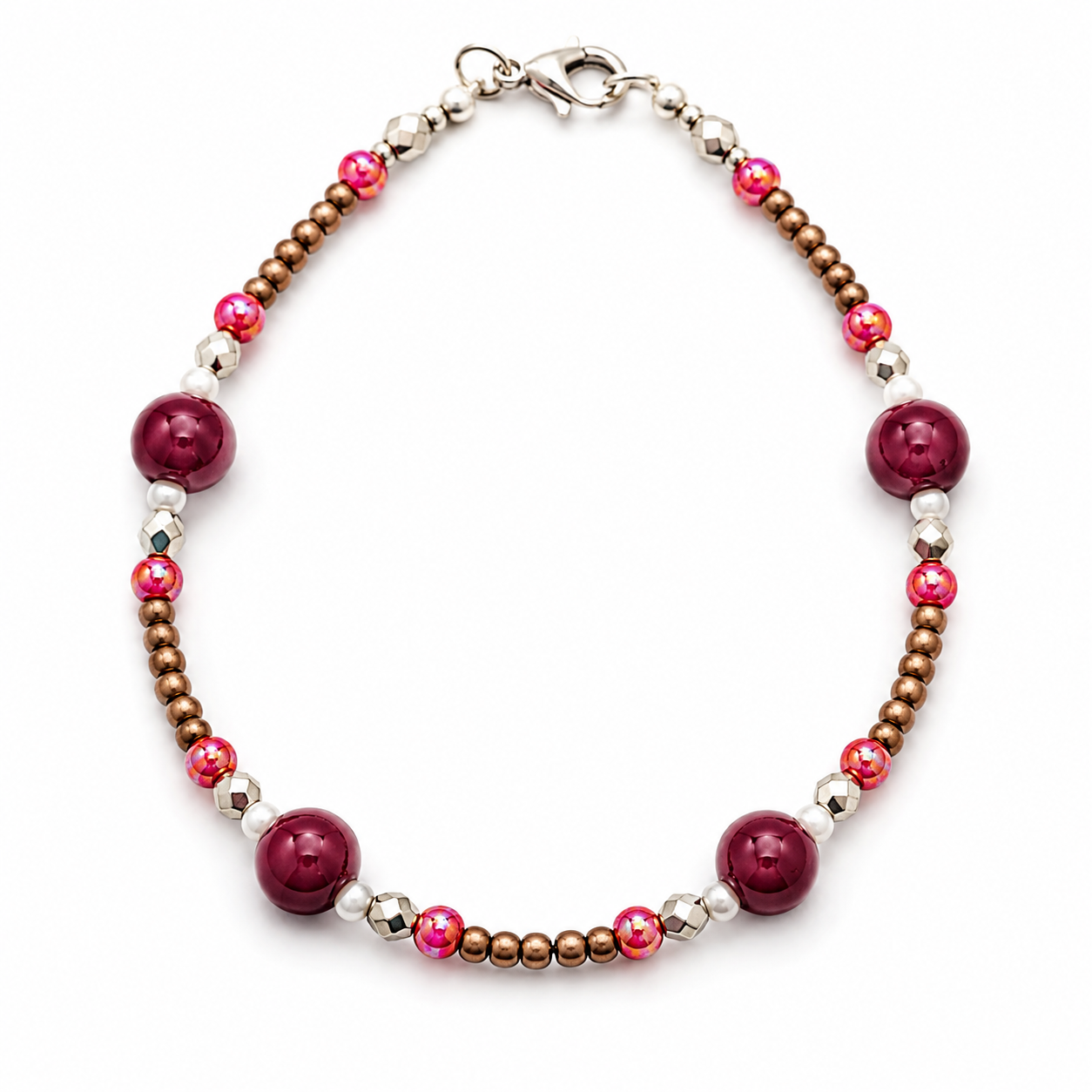 Handmade burgundy beaded bracelet with bronze seed beads, pink shimmer accents, silver faceted spacers, and pearl details on white background