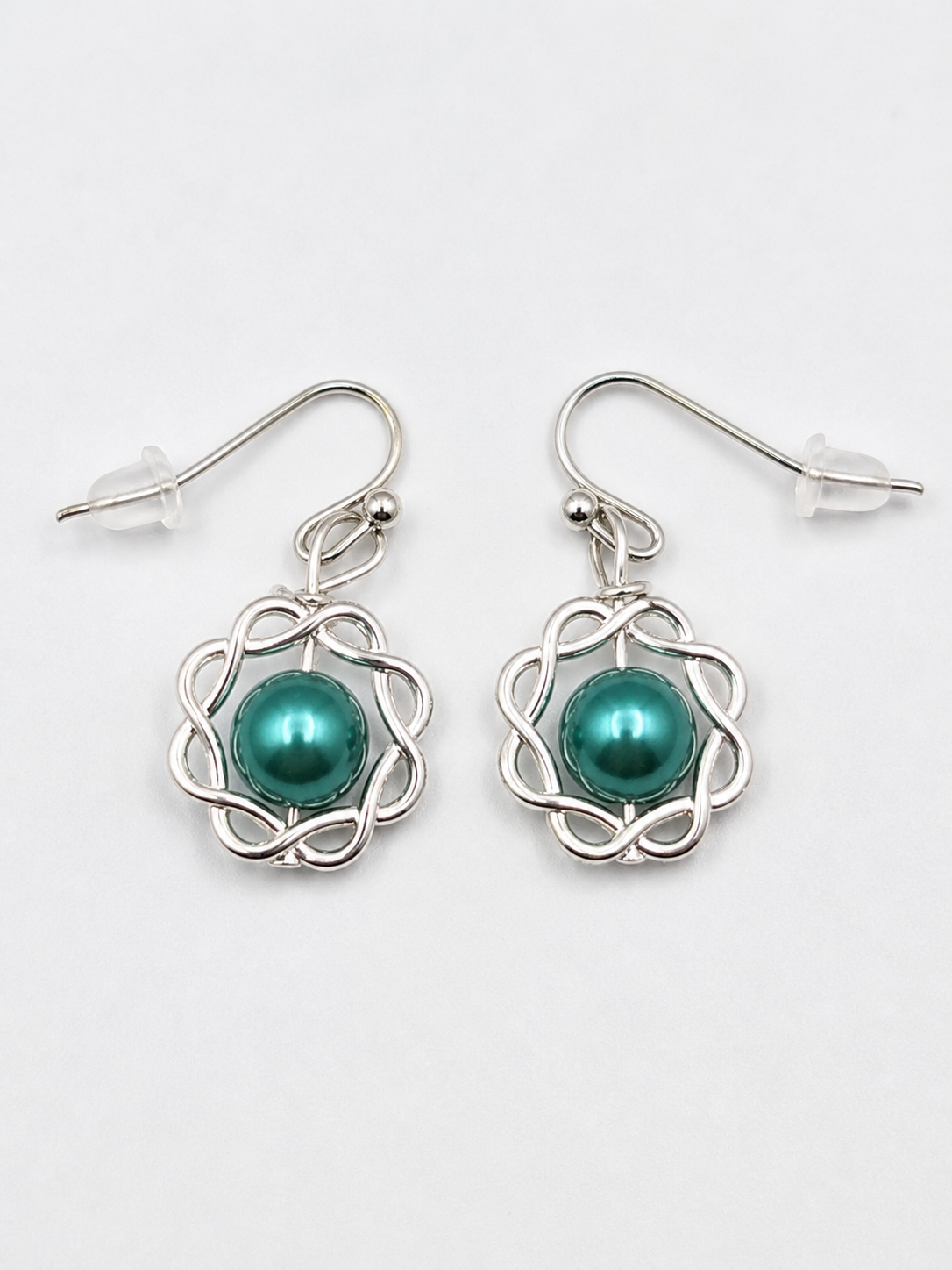 Green pearl swirl drop earrings silver handmade lightweight jewelry white background