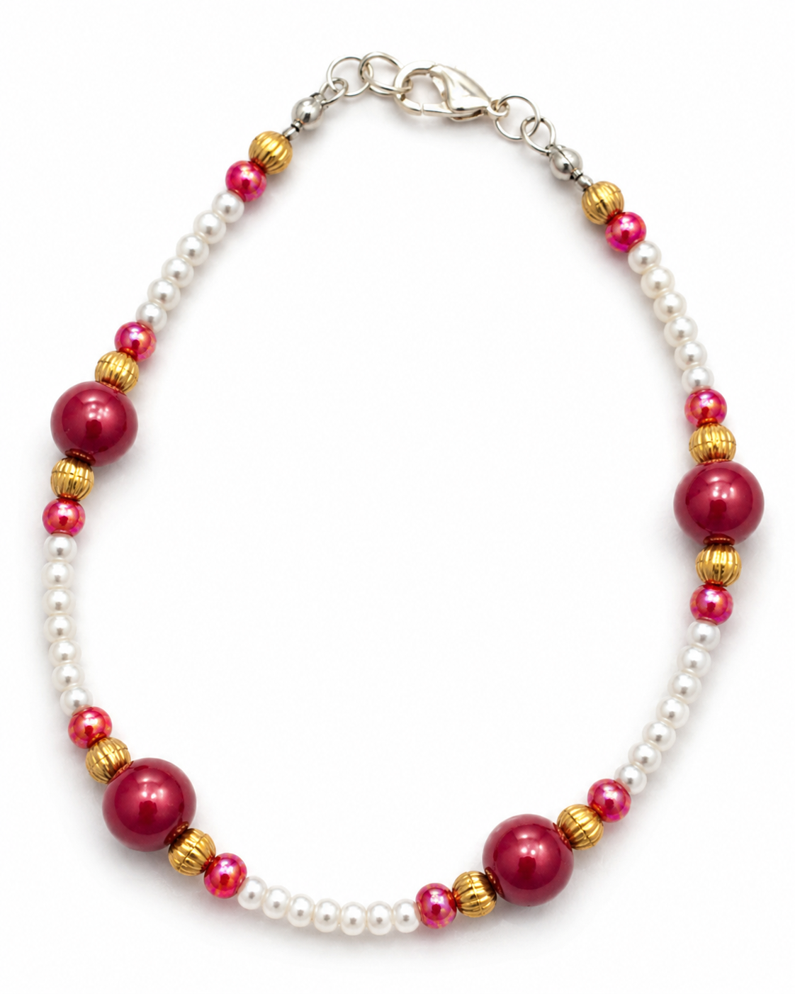 Main - Pearl and berry beaded handmade bracelet with white pearl beads, magenta accent beads, gold spacers, and silver clasp displayed on a clean white background.