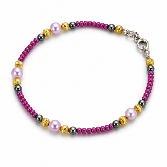 Purple beaded bracelet with pearl accents gold spacers and hematite beads handmade lightweight jewelry white background