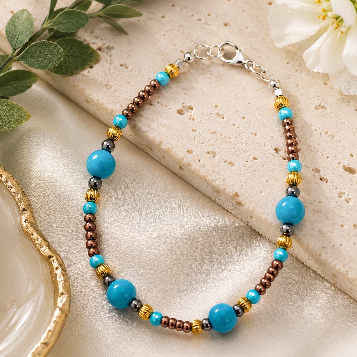 Styled - Elegant turquoise and copper handmade bracelet displayed on a neutral stone surface with floral decor and soft luxury lighting.