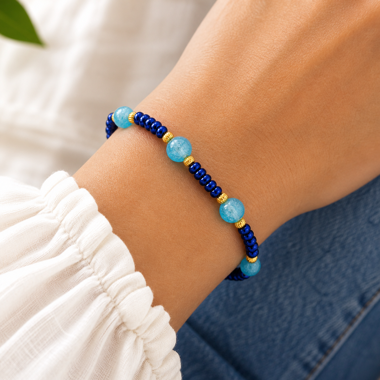 Woman wearing blue and aqua beaded bracelet close up lightweight stylish jewelry