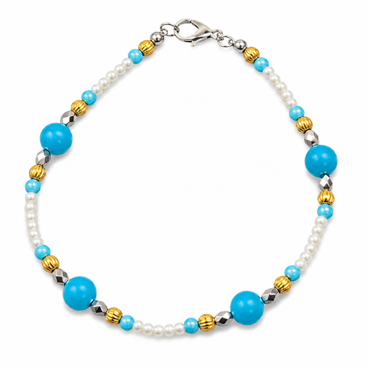 Handmade beaded bracelet featuring turquoise focal beads, white pearl seed beads, gold ribbed spacer beads, silver faceted accent beads, and a silver lobster clasp displayed on a clean white background.